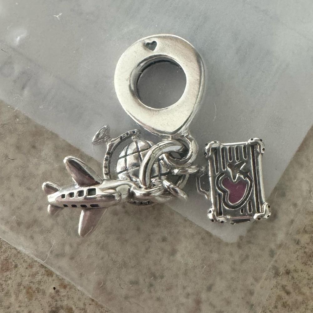 Pandora Silver Charm with Airplane Globe and Suitcase. Brand new!